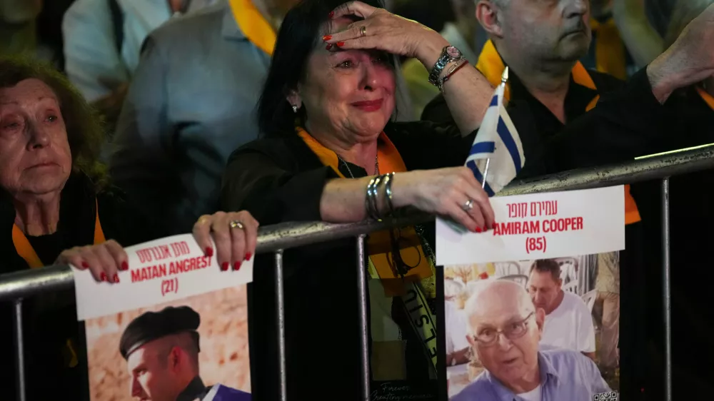 People gather in a park to demand Hamas release hostages who remain in captivity in Gaza, in Buenos Aires, Argentina, Tuesday, Sept. 30, 2025. (AP Photo/Rodrigo Abd)