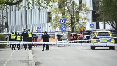 Police at the scene after a shooting incident, at Vaksala Square, in central Uppsala, Sweden, Tuesday, April 29, 2025. (Fredrik Sandberg/TT News Agency via AP)