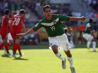 Mexico's Omar Bravo celebrates his goal against Iran during their Group D World Cup 2006 soccer match in Nuremberg June 11, 2006. FIFA RESTRICTION - NO MOBILE USE  (GERMANY)   REUTERS/Michael Dalder