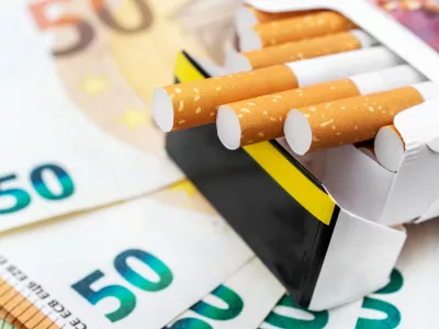 Pack of cigarettes on the euro bills. Close up.