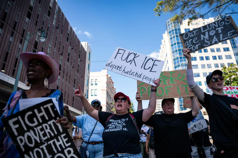 Protesters march as they rally against the deployment of the National Guard and federal agencies after U.S. President Donald Trump said the U.S. will deploy National Guard to Memphis, in Memphis, Tennessee, U.S., October 4, 2025. REUTERS/Seth Herald