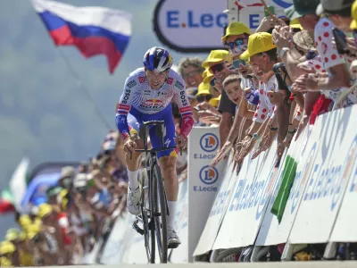 Slovenia's Primoz Roglic climbs during the thirteenth stage of the Tour de France cycling race, an individual time-trial over 10.5 kilometers (6.5 miles) in the Pyrenees mountains with start in Loudenvielle and finish in Peyragudes, France, Friday, July 18, 2025. (AP Photo/Thibault Camus)