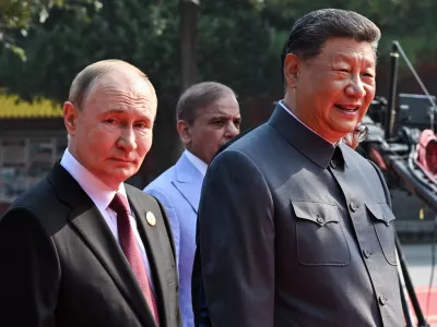03 September 2025, China, Beijing: Russian President Vladimir Putin (L) and Chinese President Xi Jinping arrive for China's Victory Day military parade marking the 80th anniversary of victory over the militarist Japan and the end of World War II. Photo: Sergei Bobylev/TASS via ZUMA Press/dpa