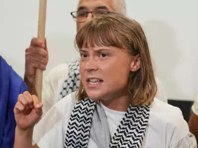 Swedish activist Greta Thunberg, who was part of the Global Sumud Flotilla seeking to deliver aid to Gaza and was detained by Israel, gestures as she delivers a statement upon her arrival to the Athens Eleftherios Venizelos International Airport, in Athens, Greece, October 6, 2025. REUTERS/Louisa Gouliamaki