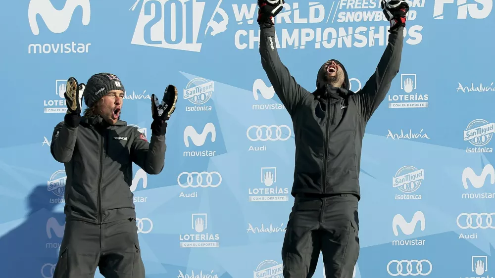 Snowboarding - FIS Snowboarding and Freestyle Skiing World Championships - Men's Snowboard Parallel Slalom - Sierra Nevada, Spain - 15/03/17 -  Gold medalist Andreas Prommegger of Austria (R) and silver medalist Benjamin Karl of Austria react on the podium. REUTERS/Albert Gea