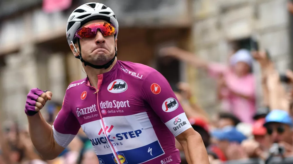 Italy's Elia Viviani celebrates as he crosses the finish line to win the 13th stage of the Giro d'Italia cycling race, from Ferrara to Nervesa della Battaglia, Italy, Friday, May 18, 2018. (Daniel Dal Zennaro/ANSA via AP)