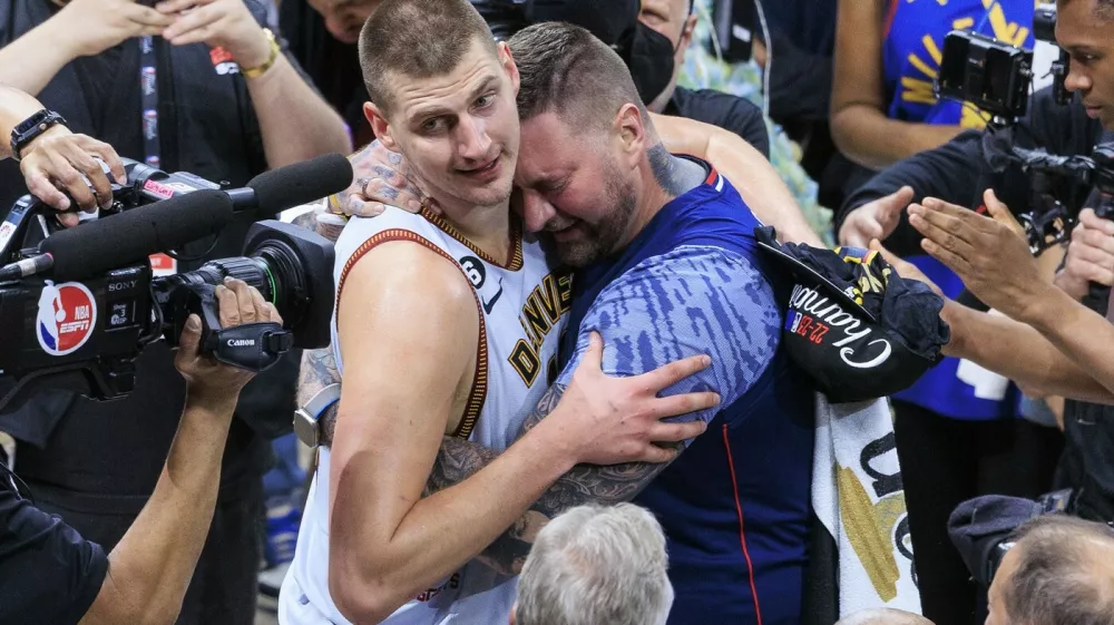 June 12, 2023, Denver, Colorado, USA: NIKOLA JOKIC #15 of the Denver Nuggets is congratulated by his brother after winning Game 5 of the 2023 NBA Finals game against the Miami Heat on Monday at Ball Arena in Denver, Colorado. Nuggets defeat Heat, 94-89.,Image: 783112254, License: Rights-managed, Restrictions:, Model Release: no, Pictured: Jokic Nikola