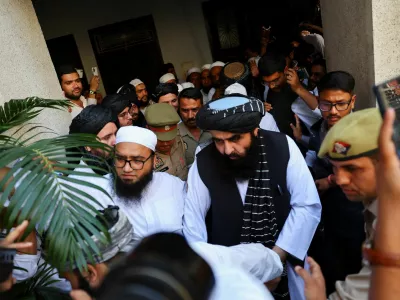 Taliban Foreign Minister Mawlawi Amir Khan Muttaqi exits a room at a guest house near the Darul Uloom Deoband, an Islamic seminary, in Deoband, Uttar Pradesh, India, October 11, 2025. REUTERS/Anushree Fadnavis
