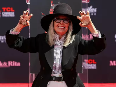 FILE PHOTO: Actor Diane Keaton shows her hands after placing them on fresh cement during a ceremony TCL Chinese theatre in Los Angeles, California, U.S., August 11, 2022. REUTERS/Mario Anzuoni/File Photo