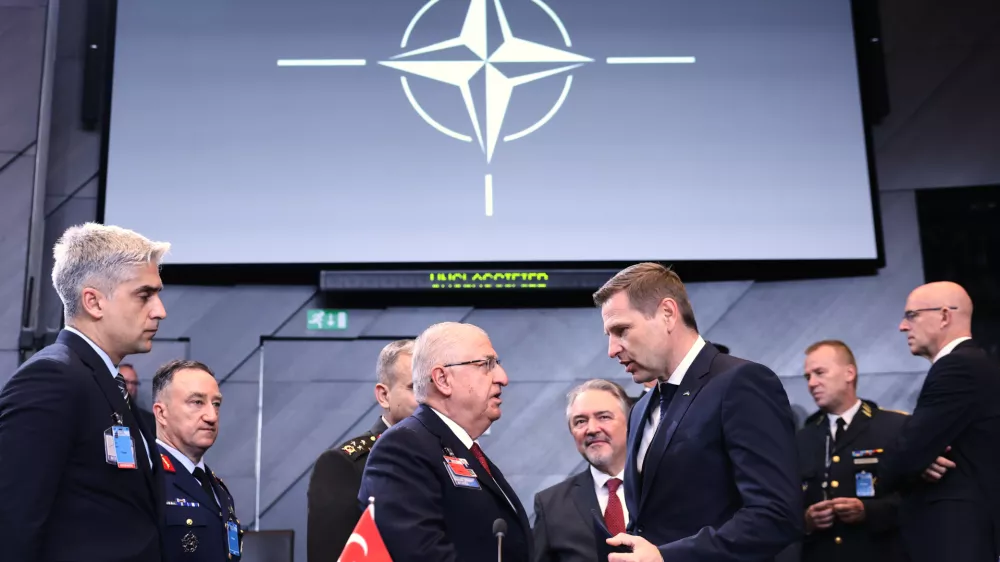 Turkish Defense Minister Yasar Guler, center left, speaks with Estonia's Defense Minister Hanno Pevkur, center right, during a meeting of the North Atlantic Council in defense ministers format at NATO headquarters in Brussels, Wednesday, Oct. 15, 2025 (AP Photo/Omar Havana)