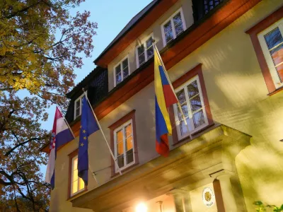 Flags hang from flagpoles attached to a building that hosts the embassies of Croatia and Venezuela in Oslo, Norway October 13, 2025. Venezuela's government said on Monday it will close its embassies in Norway and Australia and open new ones in Burkina Faso and Zimbabwe as part of a restructuring of its foreign service.  NTB/ Fredrik Varfjell/via REUTERS  ATTENTION EDITORS - THIS IMAGE WAS PROVIDED BY A THIRD PARTY. NORWAY OUT. NO COMMERCIAL OR EDITORIAL SALES IN NORWAY.