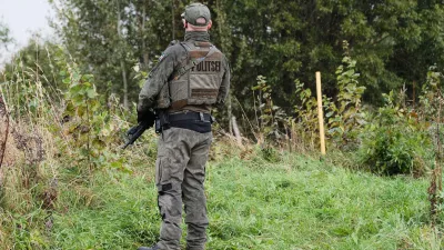 An Estonian border guard patrols the Russian border near Vinski, Estonia, Monday, Sept. 15, 2025. (AP Photo/Hendrik Osula)