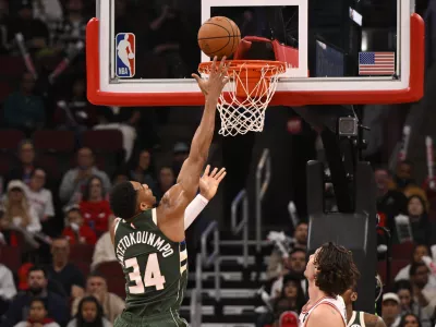 Oct 12, 2025; Chicago, Illinois, USA; Milwaukee Bucks forward Giannis Antetokounmpo (34) scores against the Chicago Bulls during the first half at the United Center. Mandatory Credit: Matt Marton-Imagn Images
