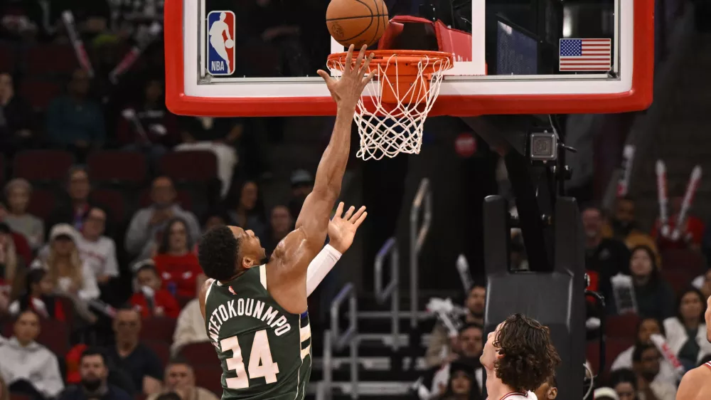 Oct 12, 2025; Chicago, Illinois, USA; Milwaukee Bucks forward Giannis Antetokounmpo (34) scores against the Chicago Bulls during the first half at the United Center. Mandatory Credit: Matt Marton-Imagn Images