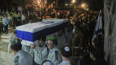 Israeli soldiers carry the coffin of slain hostage Captain Daniel Peretz during his funeral at Mt. Herzl military cemetery in Jerusalem, Wednesday, Oct. 15, 2025. (AP Photo/Francisco Seco)