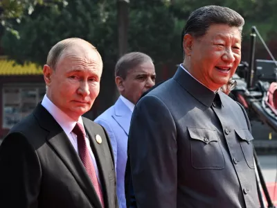 03 September 2025, China, Beijing: Russian President Vladimir Putin (L) and Chinese President Xi Jinping arrive for China's Victory Day military parade marking the 80th anniversary of victory over the militarist Japan and the end of World War II. Photo: Sergei Bobylev/TASS via ZUMA Press/dpa
