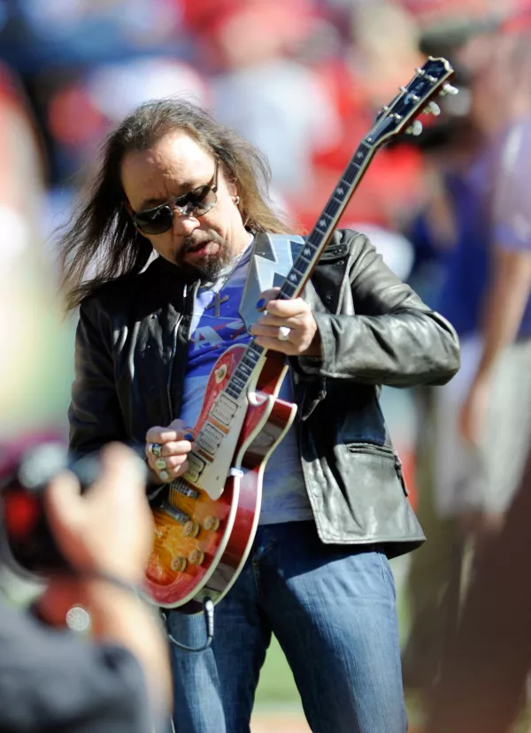 FILE - In this Oct. 4, 2009 file photo, former KISS lead guitarist Ace Frehley plays the national anthem before an NFL football game between the Kansas City Chiefs and the New York Giants in Kansas City, Mo. (AP Photo/L.G. Patterson, File)