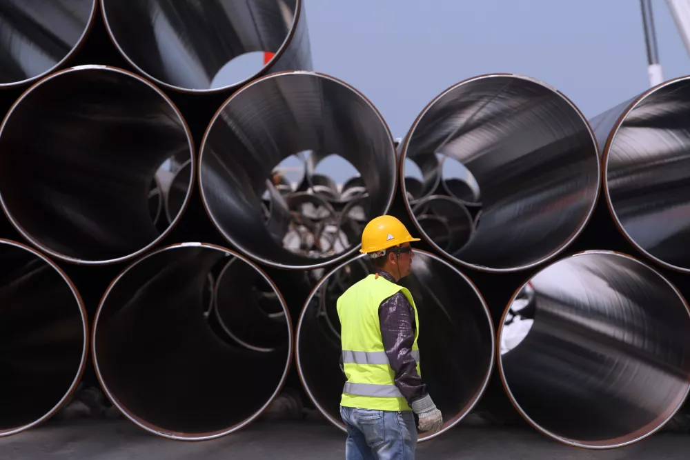 Some of the first pipes to arrive for the Trans-Adriatic Pipeline (TAP) project in Durres, Albania, Monday, April 18, 2016. Albania is part of the 878-kilometer (545 miles) TAP project that will bring gas from the Shah Deniz II field in Azerbaijan, across Turkey, Greece, Albania and undersea into southern Italy. (AP Photo/Hektor Pustina)