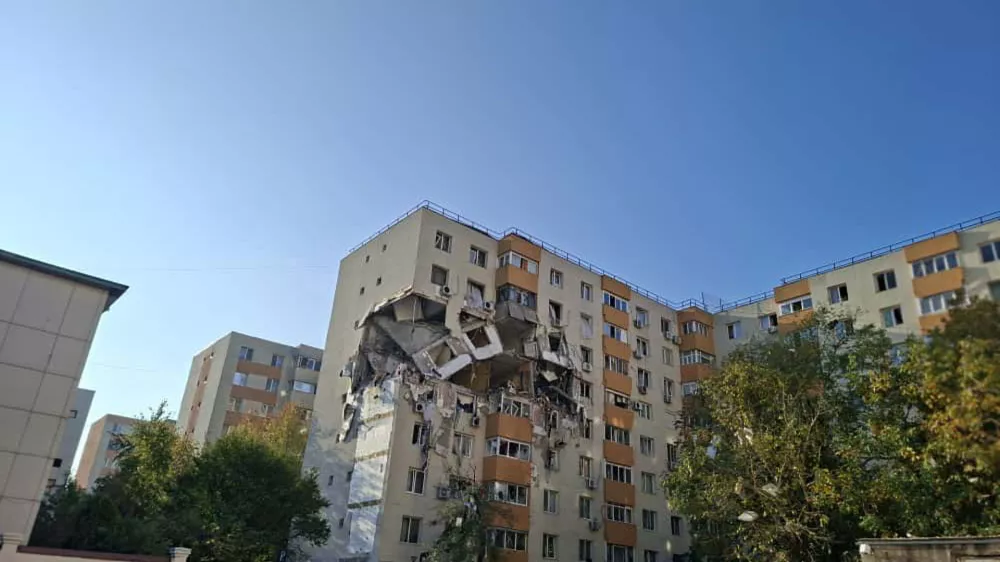 In this photograph made available by the Romanian Emergency Services, a view of a damaged apartment building after a powerful explosion in a residential block in Bucharest, Romania, Friday, Oct. 17, 2025. (Romanian Emergency Services via AP)