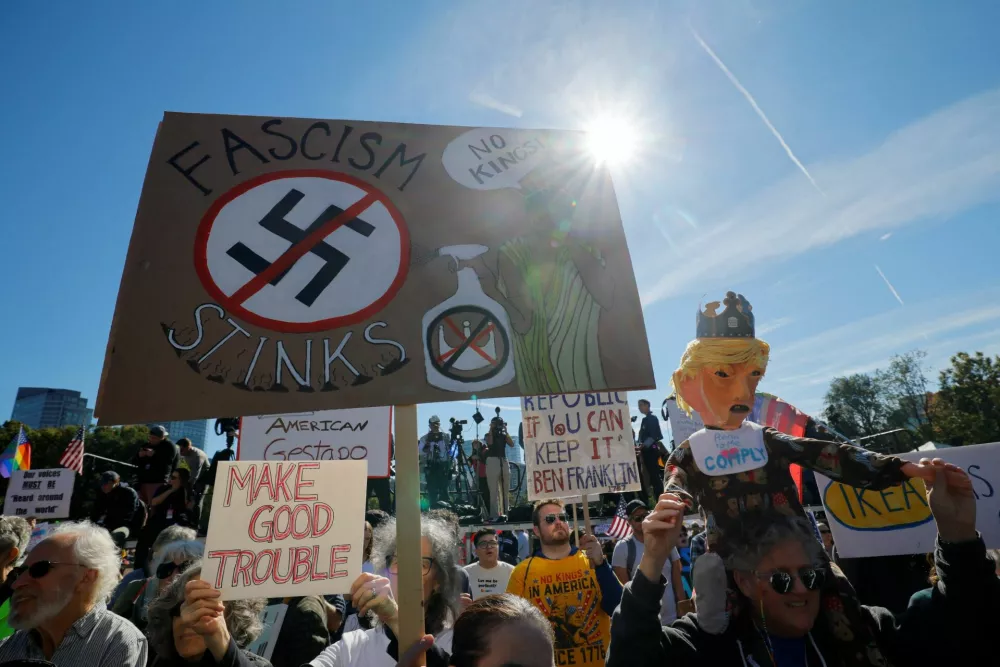 People take part in a "No Kings" protest against U.S. President Donald Trump's policies, in Boston, Massachusetts, U.S., October 18, 2025. REUTERS/Brian Snyder