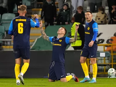 Celje's Franko Kovacevic, center, celebrates scoring during the Conference League soccer match between Shamrock Rovers and Celje in Dublin, Ireland, Thursday Oct. 23, 2025. (Brian Lawless/PA via AP)