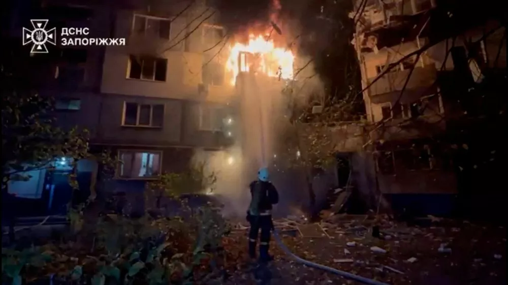 A firefighter works at the site of a Russian strike, amid Russia's attack on Ukraine, in a location given as Zaporizhzhia, Ukraine, in this screengrab from a video released on October 22, 2025. State Emergency Service Of Ukraine In Zaporizhzhia Region/Handout via REUTERS  THIS IMAGE HAS BEEN SUPPLIED BY A THIRD PARTY. MANDATORY CREDIT. VERIFICATION: Reuters was not able to independently verify the location or the date when the footage was filmed.