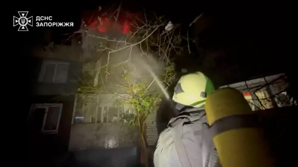 A firefighter works at the site of a Russian strike, amid Russia's attack on Ukraine, in a location given as Zaporizhzhia, Ukraine, in this screengrab from a video released on October 22, 2025. State Emergency Service Of Ukraine In Zaporizhzhia Region/Handout via REUTERS  THIS IMAGE HAS BEEN SUPPLIED BY A THIRD PARTY. MANDATORY CREDIT. VERIFICATION: Reuters was not able to independently verify the location or the date when the footage was filmed.