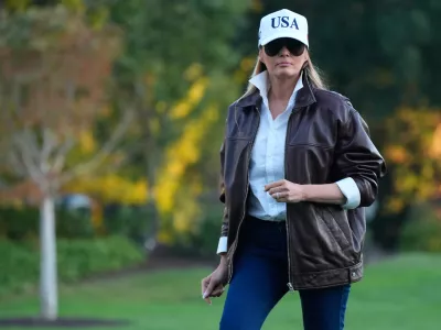 First lady Melania Trump walks toward the residence after arriving on the South Lawn of the White House on Marine One with President Donald Trump Sunday, Oct. 5, 2025, in Washington. (AP Photo/Manuel Balce Ceneta)