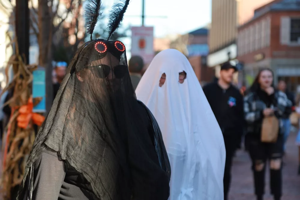 Salem, MA, US. October 31, 2023: People visiting the annual Haunted Happenings event held during the month of October in celebration of the town's history of witch trials and Halloween.
