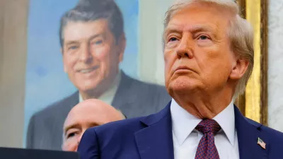 FILE PHOTO: U.S. President Donald Trump, in front of a painting of former U.S. President Ronald reagan, attends an event to announce that the Space Force Command will move from Colorado to Alabama, in the Oval Office at the White House in Washington, D.C., U.S., September 2, 2025. REUTERS/Brian Snyder/File Photo
