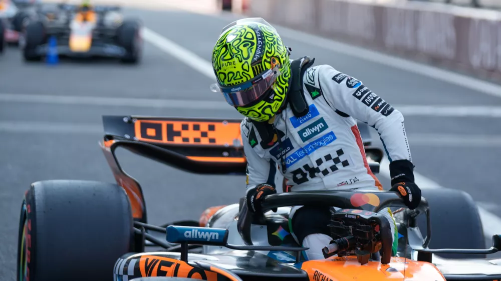 McLaren driver Lando Norris of Britain, gets out of his car after clocking the fastest time during the qualifying session for Formula One Mexico Grand Prix auto race at the Hermanos Rodriguez race track in Mexico City, Saturday, Oct. 25, 2025. (AP Photo/Fernando Llano)