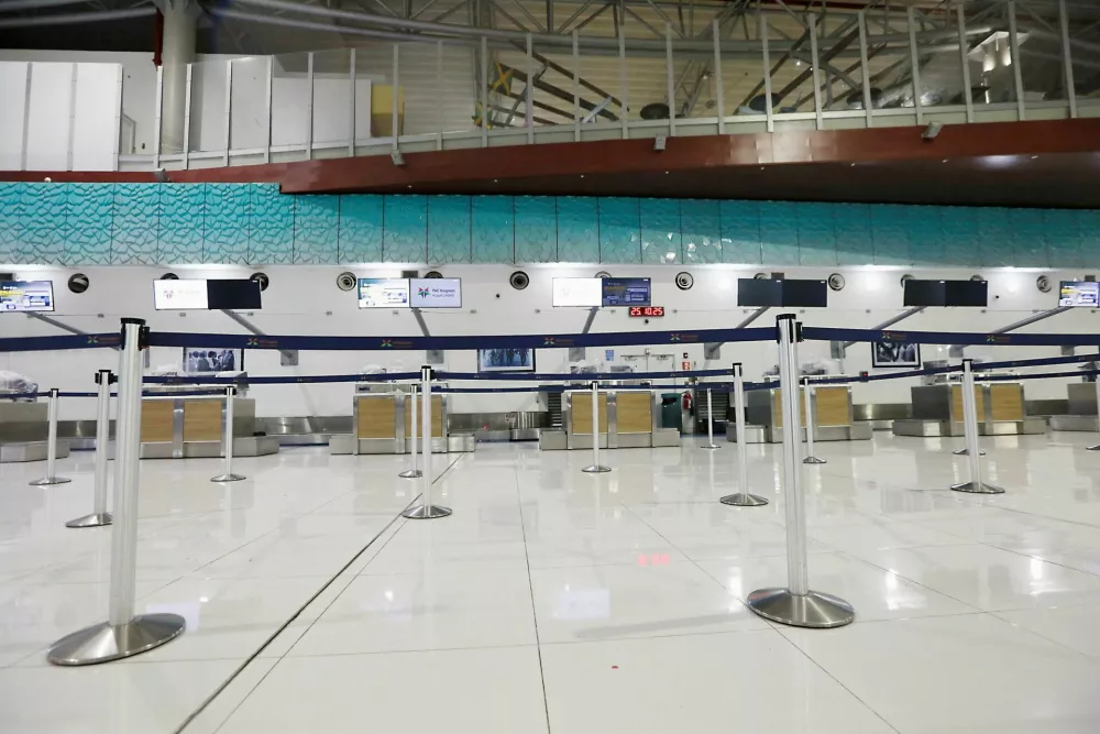 Empty counters at the airport, in preparation for the arrival of Hurricane Melissa, in Kingston, Jamaica, October 25, 2025. REUTERS/Octavio Jones