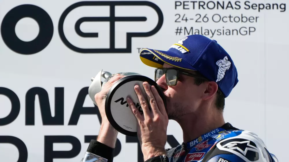 Spain's rider Alex Marquez of the BK8 Gresini Racing MotoGP celebrates on the podium after winning the MotoGP race of the Grand Prix of Malaysia at the Sepang International Circuit in Sepang, Malaysia, Sunday, Oct. 26, 2025. (AP Photo/Aaron Favila)