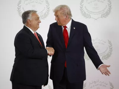 FILE PHOTO: U.S. President Donald Trump and Hungary's Prime Minister Viktor Orban shake hands as they pose for a photo, at a world leaders' summit on ending the Gaza war in Sharm el-Sheikh, Egypt, October 13, 2025. Yoan Valat/Pool via REUTERS/File Photo