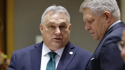 Slovakia's Prime Minister Robert Fico, right, talks to Hungary's Prime Minister Viktor Orban during a round table meeting at an EU summit in Brussels, Thursday, Feb. 1, 2024. European Union leaders meet in Brussels for a one day summit to discuss the revision of the Multiannual Financial Framework 2021-2027, including support for Ukraine. (AP Photo/Geert Vanden Wijngaert)