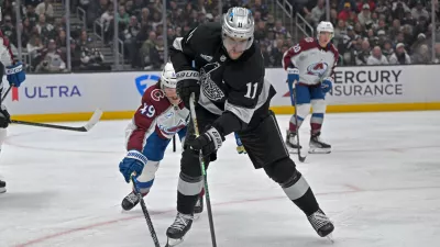Oct 7, 2025; Los Angeles, California, USA; Los Angeles Kings center Anze Kopitar (11) controls the puck during the second period against the Colorado Avalanche at Crypto.com Arena. Mandatory Credit: Jayne Kamin-Oncea-Imagn Images