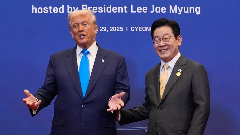 President Donald Trump poses for a photo with South Korean President Lee Jae Myung during a dinner event in Gyeongju, South Korea, Wednesday, Oct. 29, 2025. (AP Photo/Mark Schiefelbein)