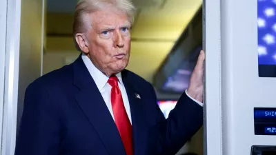 U.S. President Donald Trump reacts while speaking to members of the media on board Air Force One en route to the U.S., October 30, 2025. REUTERS/Evelyn Hockstein
