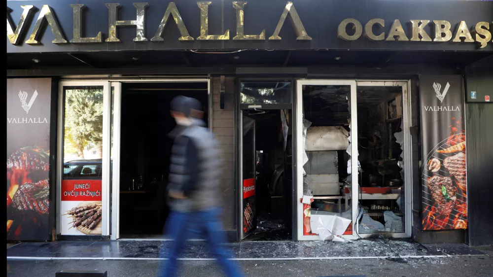 A man looks as he walks past a demolished Turkish owned restaurant in downtown, after a man was stabbed and wounded in a late-night incident in Podgorica, Montenegro, October 27, 2025. REUTERS/Stevo Vasiljevic