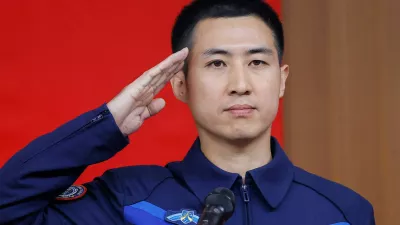 Astronaut Wu Fei salutes during a press conference before the Shenzhou-21 spaceflight mission to China's Tiangong space station, at Jiuquan Satellite Launch Center, near Jiuquan, Gansu province, China, October 30, 2025. REUTERS/Maxim Shemetov