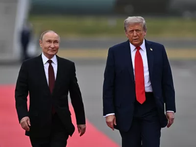 FILED - 15 August 2025, US, Alaska: US President Donald Trump walks on a red carpet alongside Russia's President Vladimir Putin ahead of their meeting in Alaska. Photo: Sergey Bobylev/Kremlin/dpa - ATTENTION: editorial use only and only if the credit mentioned above is referenced in full