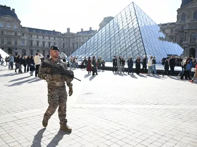 A soldier patrols in courtyard of the Louvre museum, Thursday, Oct. 30, 2025 in Paris. (AP Photo/Emma Da Silva)
