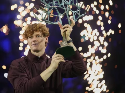 Italy's Jannik Sinner holds the trophy after winning the final match of the Paris Masters tennis tournament against Canada's Felix Auger-Aliassime in Paris, Sunday, Nov. 2, 2025. (AP Photo/Christophe Ena)