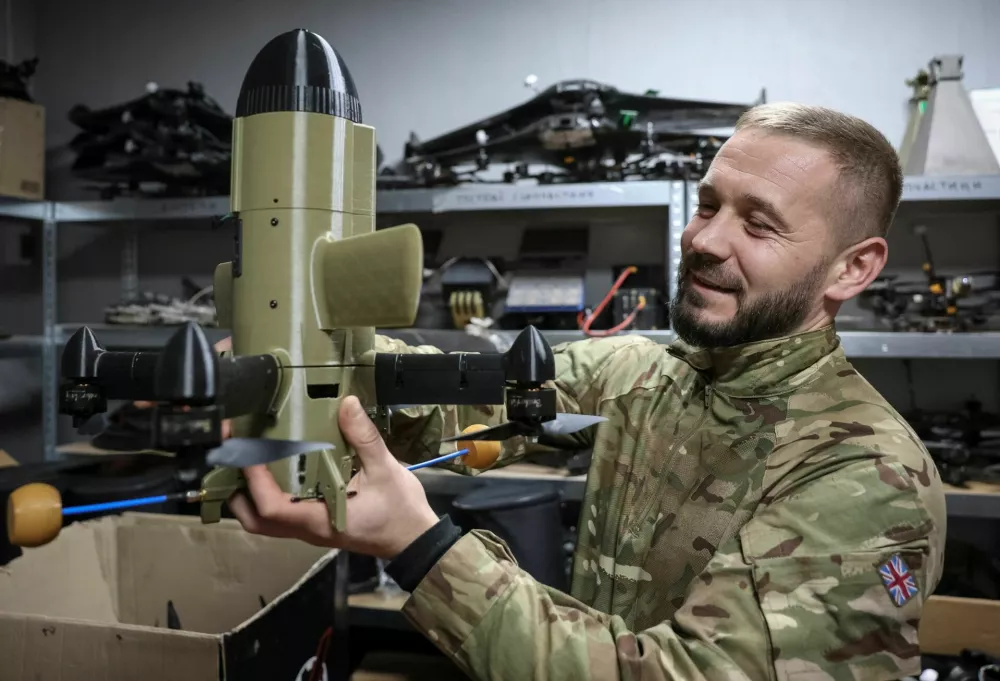 A serviceman from the SQUADRON interceptor unit of the 3rd Army Corps of the Ukrainian Armed Forces demonstrates a Ukrainian drone-interceptor Sting, amid Russia's attack on Ukraine, near the frontline in eastern Ukraine, October 30, 2025. REUTERS/Anatolii Stepanov