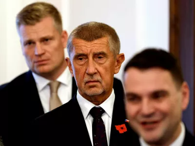 Leader of ANO party Andrej Babis stands between the leader of the Motorists party Petr Macinka and the honorary president of the Motorists party Filip Turek after signing a coalition agreement at the Czech Parliament in Prague, Czech Republic, November 3, 2025. REUTERS/David W Cerny