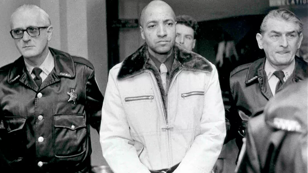 FILE - Convicted killer George Banks, center, is led through the Luzerne County, Pa. courthouse, on the way to his sentencing on Nov. 22, 1985. (Clark Van Orden/The Times Leader via AP, File)