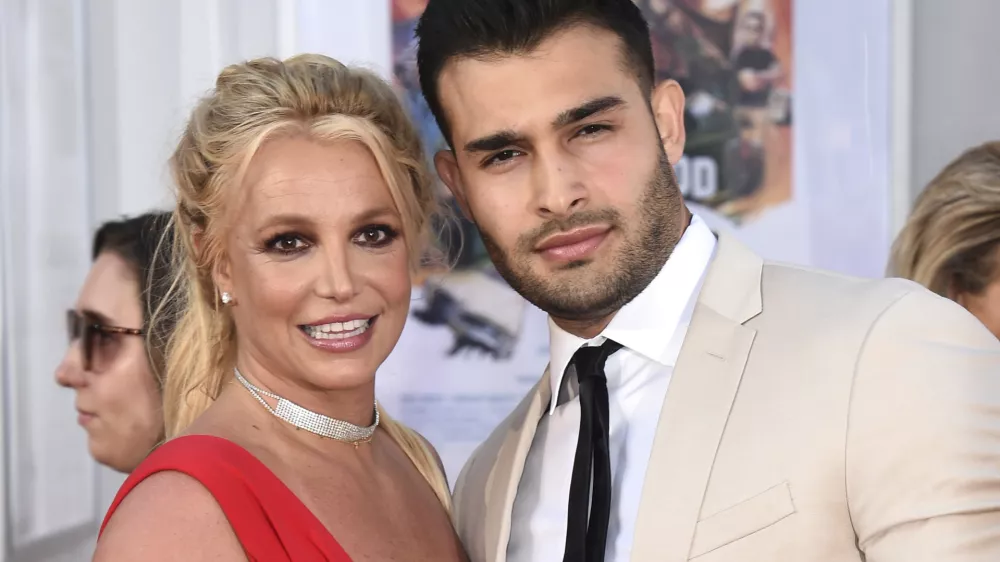 FILE - Britney Spears and Sam Asghari appear at the Los Angeles premiere of "Once Upon a Time in Hollywood" on July 22, 2019. Asghari has filed for divorce from Spears, a person familiar with the filing said late Wednesday, Aug. 16, 2023. The person, who is close to Asghari but not authorized to speak publicly, confirmed the filing happened Wednesday, hours after several outlets including TMZ and People magazine reported the couple had separated. (Photo by Jordan Strauss/Invision/AP, File)