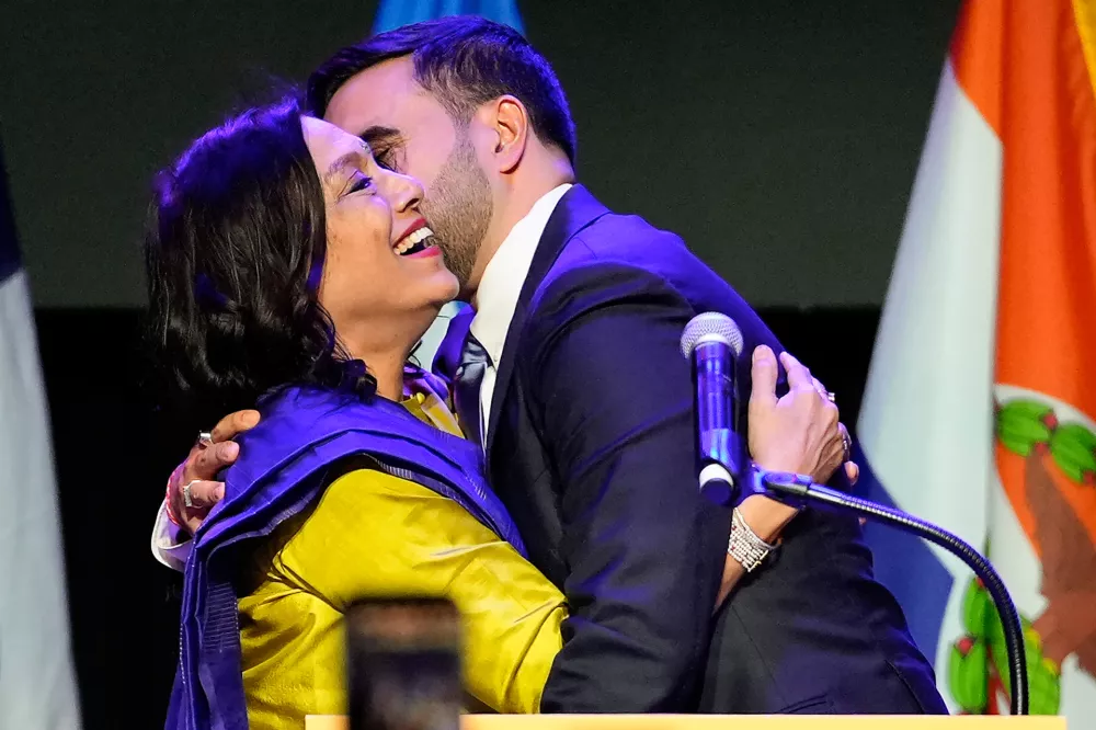 Mayor-elect Zohran Mamdani right, greets his mother Mira Nair, after making an acceptance speech, Tuesday, Nov. 4, 2025, in New York. (AP Photo/Yuki Iwamura)