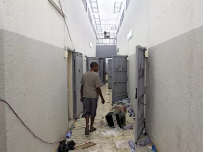 A Libyan walks inside the Abu Salim prison in Tripoli, LIbya, Friday, Aug. 26, 2011, one Libya's most notorious prisons and the scene of a 1996 massacre of prisoners. (AP Photo/Sergey Ponomarev)
