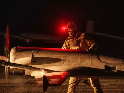 FILE - A Ukrainian serviceman of the 14th Separate Unmanned Aerial Systems Regiment prepares a long-range drone An-196 Liutyi before takeoff in undisclosed location, Ukraine, Tuesday, Oct. 14, 2025. (AP Photo/Evgeniy Maloletka, File)